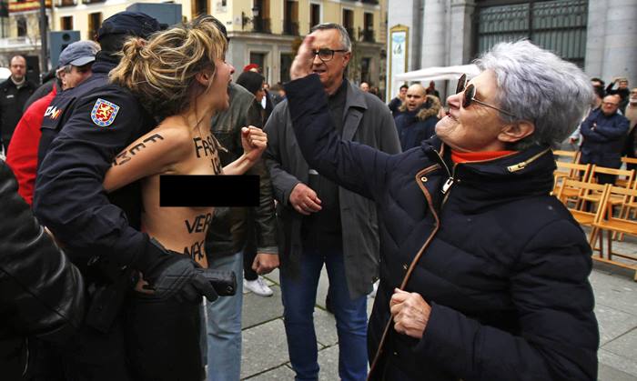 Femen topless prostesters disrupt Francisco Franco memorial in Madrid