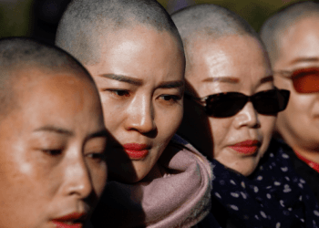 Chinese Wives Shave Heads in Protest