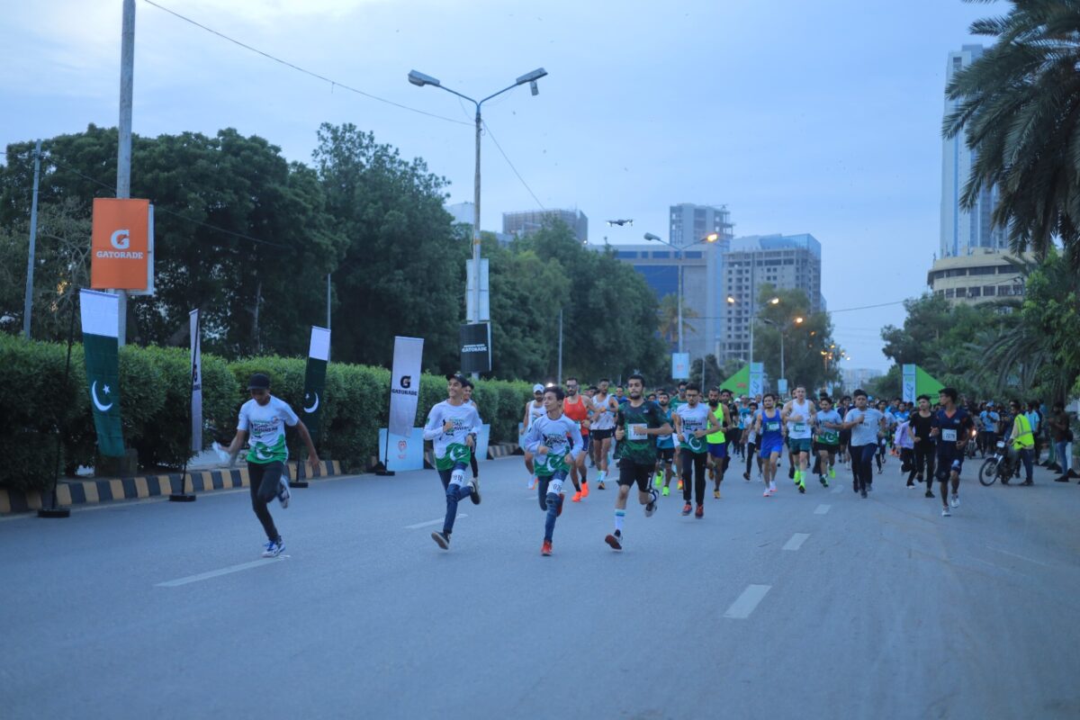 a group of people running on a street